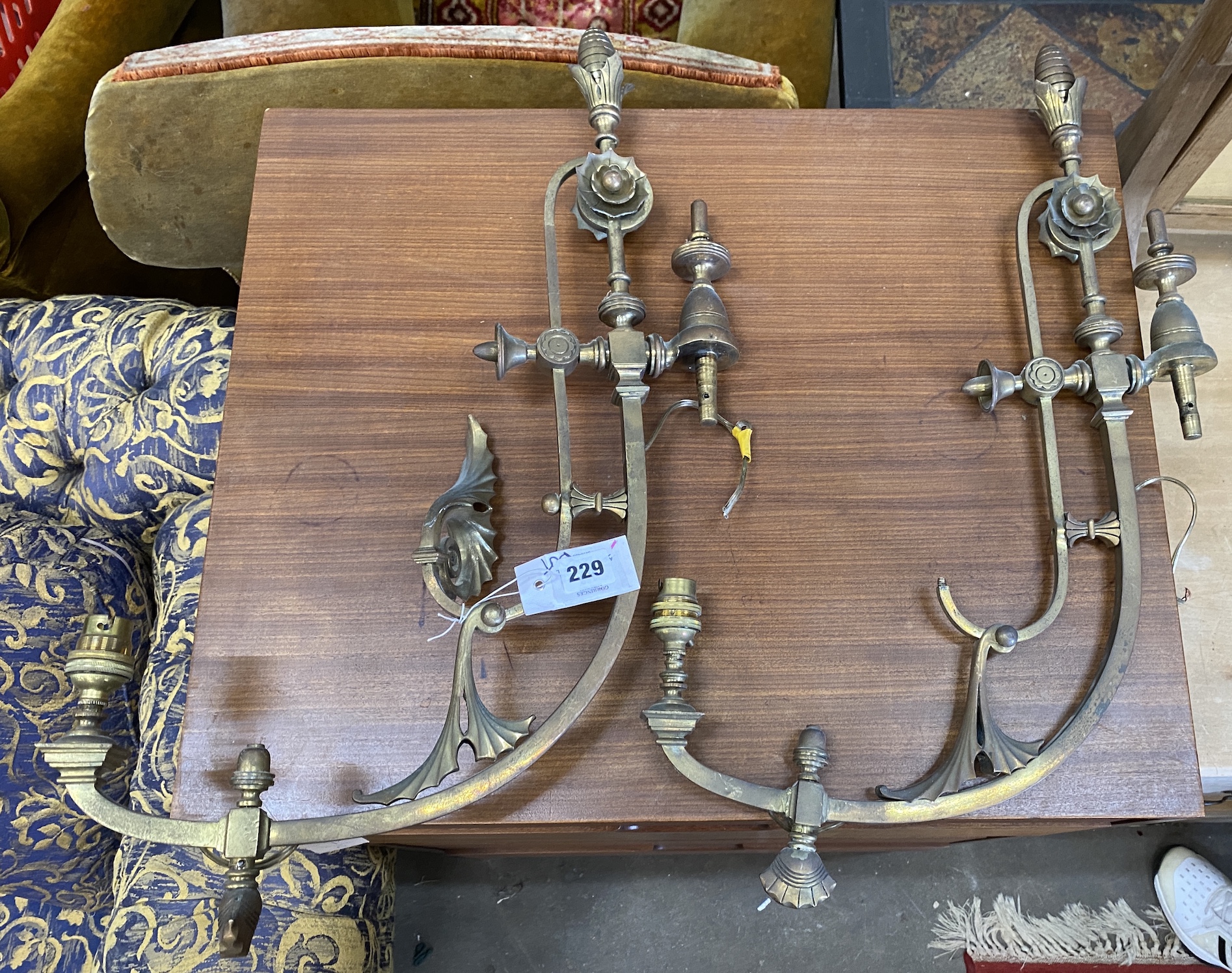 Two pairs of brass wall lights and one other, largest 60cm high